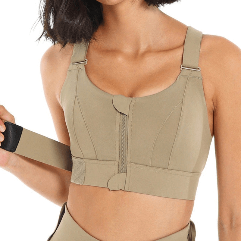 Stylish women's shockproof sports bra with adjustable fastening in beige, offering comfort and support for fitness activities.